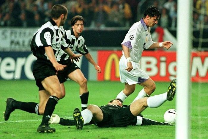 Real Madrid's Predrag Mijatovic (right) dribbles around Juventus goalie Angelo Peruzzi as he scores the winning goal in their 1998 Champions League final in Amsterdam