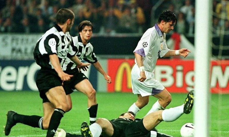 Real Madrid's Predrag Mijatovic (right) dribbles around Juventus goalie Angelo Peruzzi as he scores the winning goal in their 1998 Champions League final in Amsterdam