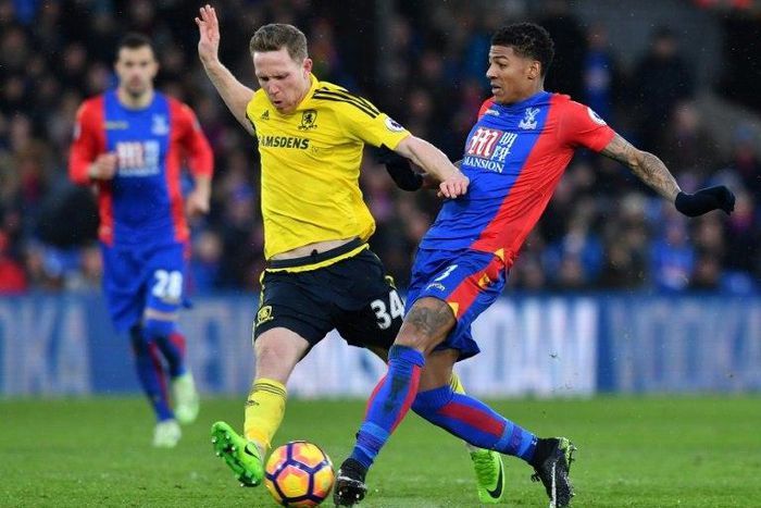 Middlesbrough's midfielder Adam Forshaw (L) vies with Crystal Palace's defender Patrick van Aanholt during the English Premier League football match February 25, 2017