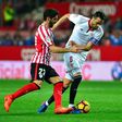 Sevilla's midfielder Vicente Iborra (R) vies with Athletic's midfielder Raul Garcia during the Spanish league football match March 2, 2017