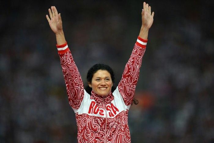 Russia's gold medalist Tatyana Lysenko poses on the podium of the women's hammer throw at the athletics event held at the Olympic Stadium during the London 2012 Olympic Games on August 11, 2012 in London