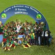 Cameroon's players celebrate with the trophy at the end of the 2017 Africa Cup of Nations final football match between Egypt and Cameroon at the Stade de l'Amitie Sino-Gabonaise in Libreville on February 5, 2017