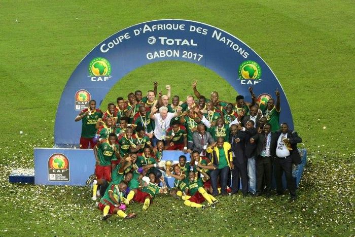 Cameroon's players celebrate with the trophy at the end of the 2017 Africa Cup of Nations final football match between Egypt and Cameroon at the Stade de l'Amitie Sino-Gabonaise in Libreville on February 5, 2017