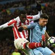 Stoke City's striker Mame Biram Diouf (L) vies with Manchester City's striker Sergio Aguero during a English Premier League football match at the Etihad Stadium in Manchester, north west England, on March 8, 2017