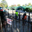 Workers supervise the destruction of greenhouses in the Auteuil botanical garden in Paris, on October 5, 2016 in order to allow the construction of a new stadium for Roland Garros