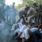 Protests broke out after police escorted two women into a flashpoint temple in the southern Indian state of Kerala on Wednesday
