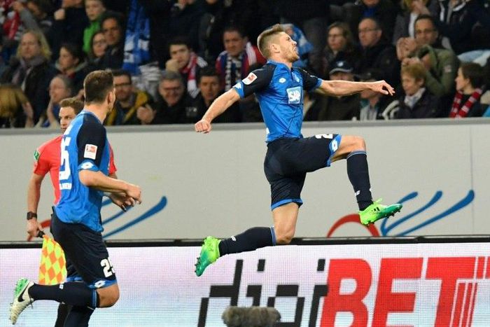 Hoffenheim's forward Andrej Kramaric (R) celebrates after he scored against Bayern Munich in Sinsheim, southwestern Germany on April 4, 2017