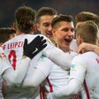 Leipzig's defender Willi Orban celebrates with teamates after scoring his team's third goal against Hertha BSC Berlin in Leipzig, eastern Germany on December 17, 2016