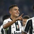 Paulo Dybala (left) celebrates with Juan Cuadrado after scoring for Juventus against Udinese on October 15, 2016 in Turin