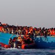 A rescue boat of the Spanish NGO Proactiva approaches an overcrowded wooden vessel with migrants from Eritrea, off the Libyan coast in Mediterranean Sea August 29, 2016.