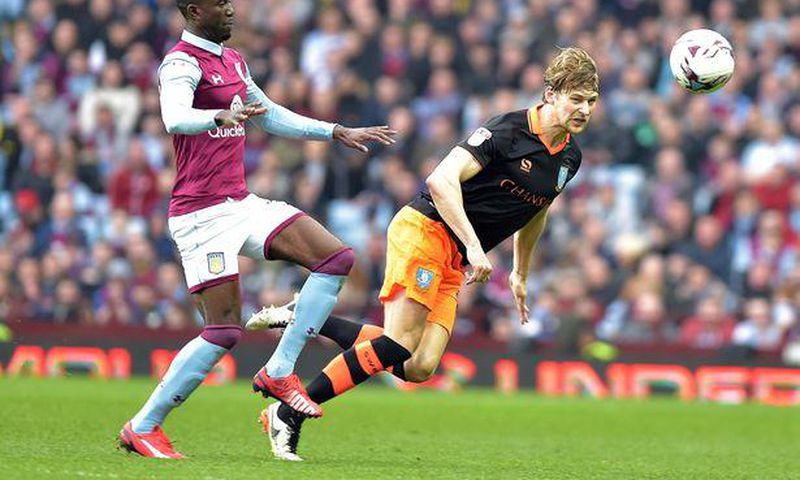 ___6355731___https:______static.pulse.com.gh___webservice___escenic___binary___6355731___2017___3___11___19___Jonathan-Kodjia-and-Glenn-Loovens-battle-for-the-ball