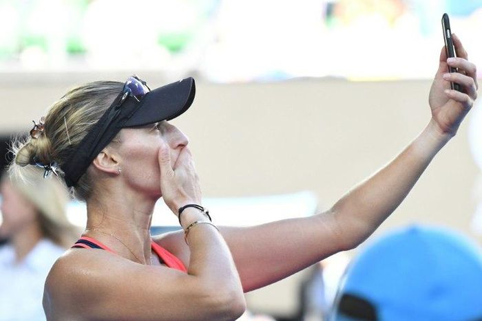 Croatia's Mirjana Lucic-Baroni films the crowd with her phone following her defeat to Serena Williams of the US in their Australian Open semi-final in Melbourne on January 26, 2017