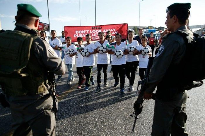 Palestinian youths wanting to play football in the Maale Adumim settlement in the Israeli occupied West Bank are blocked by Israeli security forces on October 11, 2016