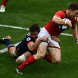 France's fullback Brice Dulin (L) tackles Wales' wing George North on March 18, 2017