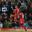 Liverpool's midfielder Philippe Coutinho (L) celebrates scoring their second goal with Liverpool's midfielder Sadio Mane (R) during the English Premier League football match between Liverpool and West Bromwich Albion on October 22, 2016