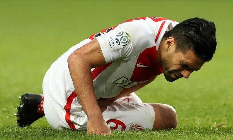 Monaco's Colombian forward Radamel Falcao grimaces in pain after falling during the French L1 football match against Bordeaux on March 11, 2017