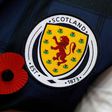 A Scottish supporter pay respect to the country's war dead before a World Cup 2018 qualification match against England at Wembley Stadium in November 2016