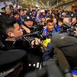Argentine striker Carlos Tevez makes his way through the arrivals halls at Shanghai Pudong International Airport in Shanghai on January 19, 2017, where he will join local side Shenhua in a deal that reportedly makes him world's top-earning footballer