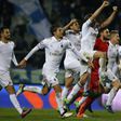 AC Milan's players celebrate at the end of the Italian Serie A football match between Empoli and AC Milan on November 26, 2016