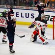 Hilary Knight (L) of the United States celebrates her game winning overtime goal against Canada in the gold medal game at the 2017 IIHF Woman's World Championships