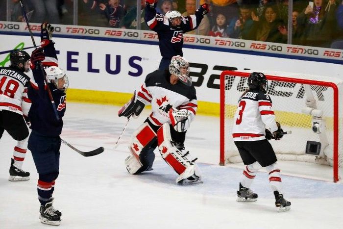 Hilary Knight (L) of the United States celebrates her game winning overtime goal against Canada in the gold medal game at the 2017 IIHF Woman's World Championships