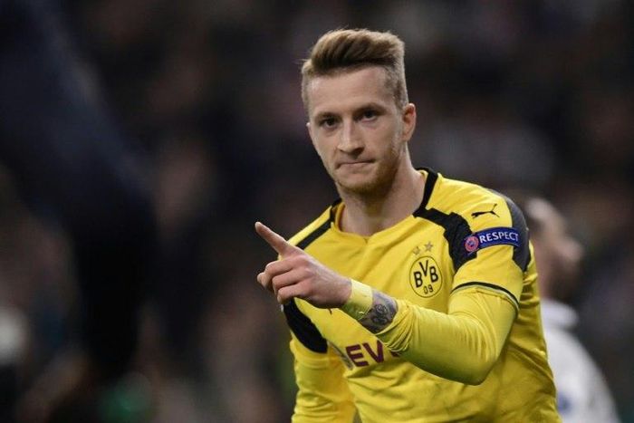 Dortmund's midfielder Marco Reus celebrates a goal during the UEFA Champions League football match Real Madrid CF vs Borussia Dortmund at the Santiago Bernabeu stadium in Madrid on December 7, 2016
