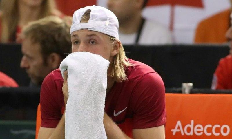 Denis Shapovalov of Canada reacts after accidentaly hitting the head referee Arnaud Gabas on February 5, 2017