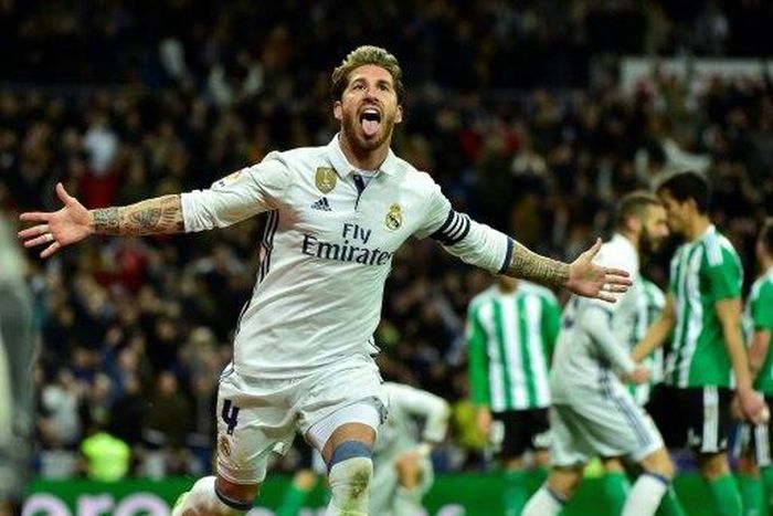 Real Madrid's defender Sergio Ramos celebrates after scoring a goal during the Spanish league footbal match Real Madrid CF vs Real Betis at the Santiago Bernabeu stadium in Madrid on March 12, 2017