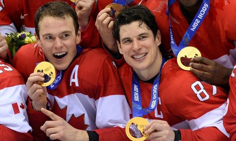 Canada's gold medallists Jonathan Toews (left) and Sidney Crosby pose during the Men's Ice Hockey Medal Ceremony during the Sochi Winter Olympics on February 23, 2014