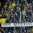 Fans hold a banner reading "Get well Marc" ahead the UEFA Champions League 1st leg quarter-final football match BVB Borussia Dortmund v Monaco in Dortmund, western Germany on April 12, 2017