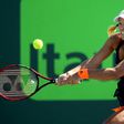 Angelique Kerber of Germany returns a shot to Risa Ozaki of Japan during their Miami Open 4th round match, at the Crandon Park Tennis Center in Key Biscayne, Florida, on March 27, 2017