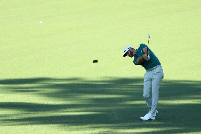 Dustin Johnson of the United States plays an approach shot on the second hole during a practice round prior to the start of the 2017 Masters Tournament on April 4, 2017 in Augusta, Georgia