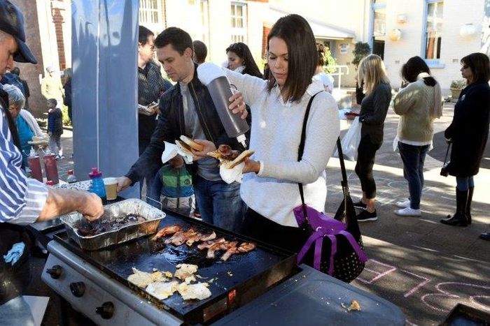 The Australian word of the year 2016 is 'democracy sausage', a barbecued sausage bought at a polling station on election day