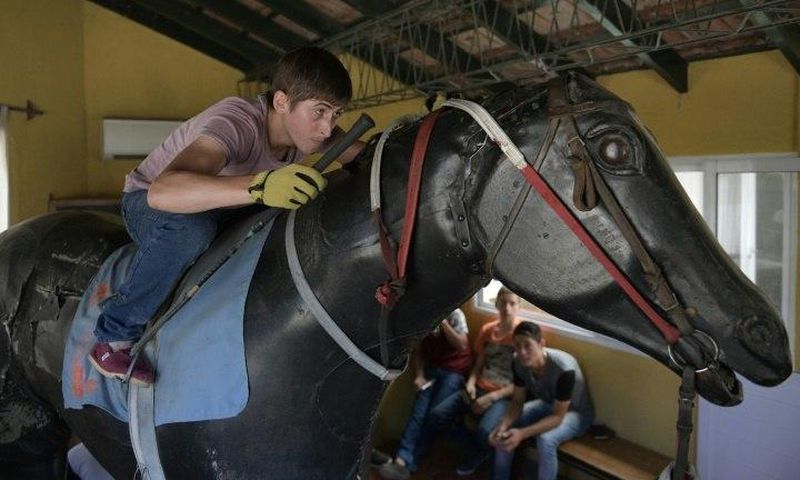 Apprentice Lucas Berticelli rides a mechanical racehorse at the San Isidro Jockey Club school on the outskirts of Buenos Aires