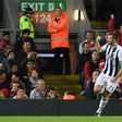 West Bromwich Albion's defender Gareth McAuley celerbates scoring their first goal during the English Premier League football match between Liverpool and West Bromwich Albion at Anfield in Liverpool, north west England on October 10, 2016