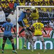 Uruguay's Diego Godin (2nd L) and Colombia's defender Yerry Mina (2nd R) jump for a header during their Russia 2018 FIFA World Cup qualifier football match in Barranquilla, Colombia, on October 11, 2016