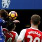Chelsea's Marcos Alonso rises above Arsenal's Hector Bellerin to score the opening goal during their English Premier League match at Stamford Bridge in London, on February 4, 2017