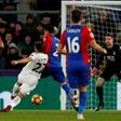 Swansea City's Angel Rangel shoots to score their second goal against Crystal Palace in south London on January 3, 2017