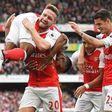 Theo Walcott (L) celebrates with teammates Shkodran Mustafi (2nd L), Alexis Sanchez (2nd R) and Granit Xhaka after scoring Arsenal's second goal against Swansea City
