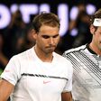Roger Federer (R) with Rafael Nadal after their final at the Australian Open on January 29, 2017