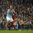 Manchester City's Vincent Kompany reacts after fouling Liverpool's Mohamed Salah