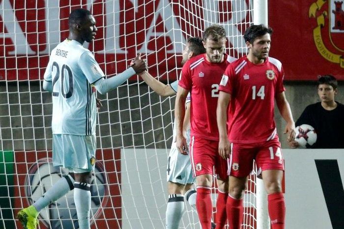 Belgium's forward Christian Benteke (L) celebrates his goal on October 10, 2016