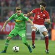 Moenchengladbach's striker Andre Hahn (L) and Bayern Munich's midfielder Javi Martinez vie for the ball during the German first division Bundesliga football match between FC Bayern Munich and Borussia Moenchengladbach on October 22, 2016