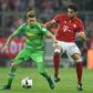 Moenchengladbach's striker Andre Hahn (L) and Bayern Munich's midfielder Javi Martinez vie for the ball during the German first division Bundesliga football match between FC Bayern Munich and Borussia Moenchengladbach on October 22, 2016