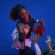 Serena Williams nearly scrawled with marker pen on an designer pink hat when she was handed it after her win over Johanna Konta