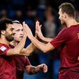 AS Roma's forward Mohamed Salah (L) celebrates with teammates Edin Dzeko (R) and Radja Nainggolan after scoring on November 6, 2016