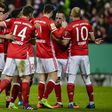 Bayern Munich's striker Robert Lewandowski (C) celebrates the third goal with teammates during the German Cup DFB Pokal quarter-final football match against Schalke 04 March 1, 2017