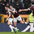 Burnley's midfielder Robbie Brady (L) celebrates with teammates after scoring against Chelsea at Turf Moor in Burnley, north west England on February 12, 2017