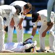 Bangladesh's Mushfiqur Rahim is checked by New Zealand's Tom Latham (L), Tim Southee (C) and Neil Wagner after Rahim was hit in the head during their first Test match, in Wellington, on January 16, 2017