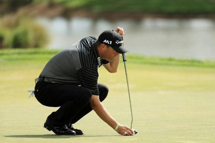 Ryan Palmer of the United States lines up a putt on the first green during the second round of The Honda Classic at PGA National Resort and Spa on February 24, 2017 in Palm Beach Gardens, Florida